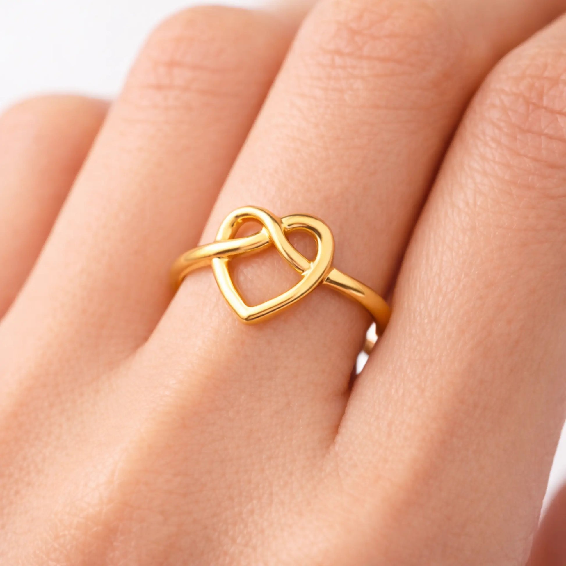 Gold heart infinity ring worn on finger, minimalist everyday anti-tarnish jewellery by Yubiraa