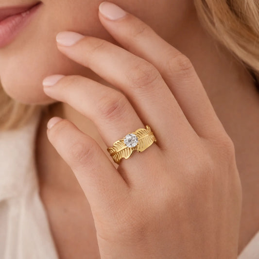 Model wearing YUBIRAA Leaf of Light Solitaire Ring, showcasing the elegant gold leaf design with solitaire stone on hand for everyday styling.