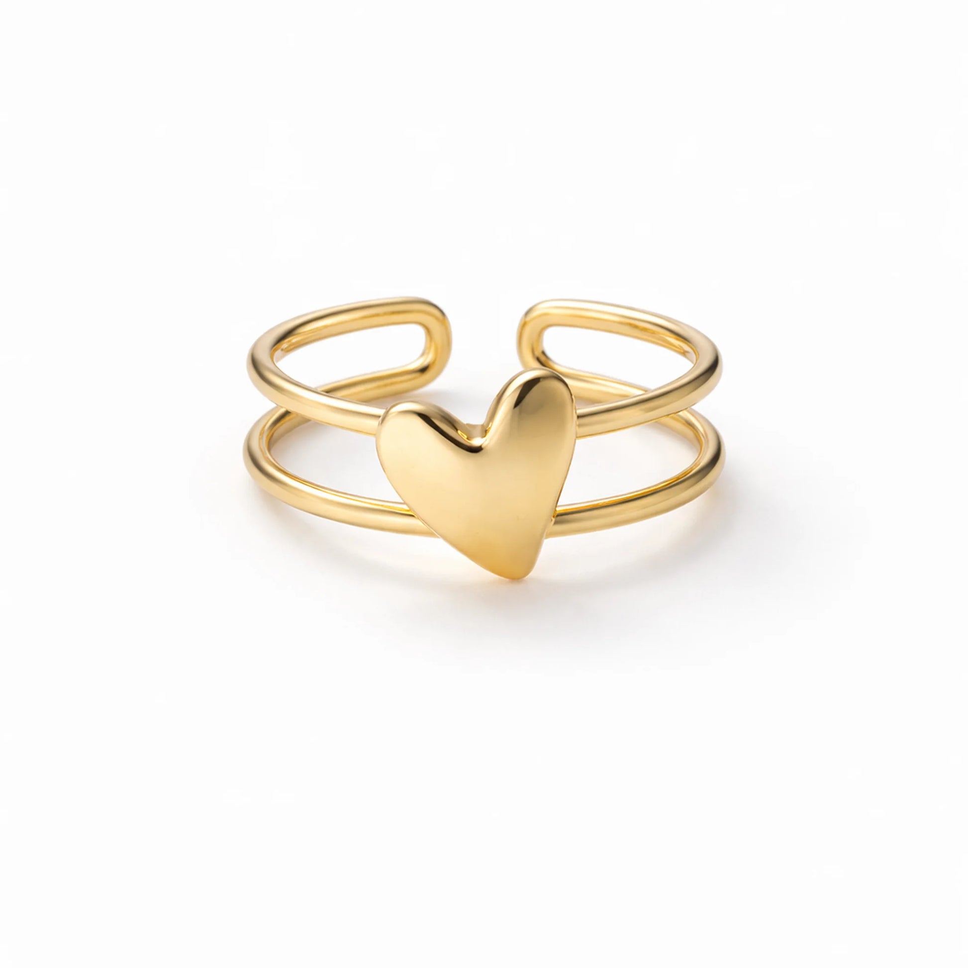 Gold heart-shaped ring on a white background