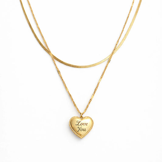 Gold heart-shaped double layered anti tarnish necklace with 'Love You' engraving on a white background