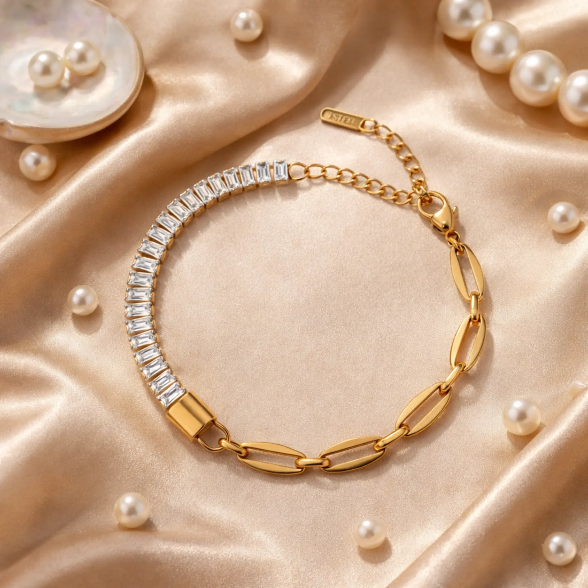 Gold bracelet with diamond accents on a beige satin background with pearls