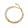Gold bracelet with clear gemstones on a white background
