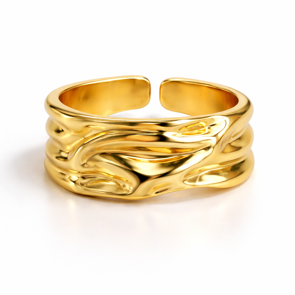 closeup view of YUBIRAA molten gold ring showcasing fluid sculpted texture and bold handcrafted form view