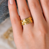 YUBIRAA molten gold ring worn on finger, showcasing bold sculptural design and adjustable fit