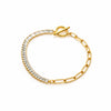 Gold bracelet with clear gemstones on a white background