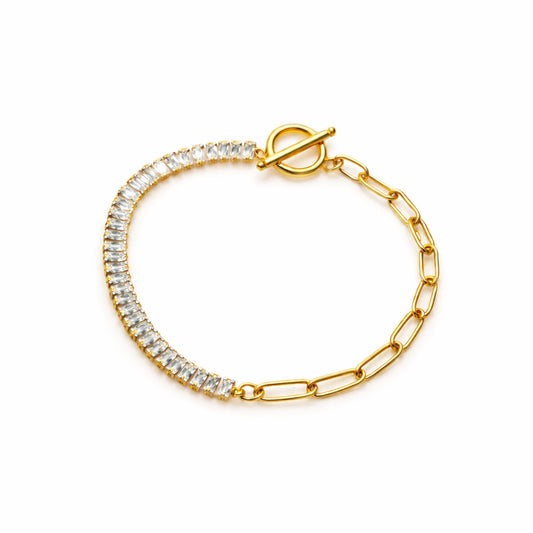Gold bracelet with clear gemstones on a white background