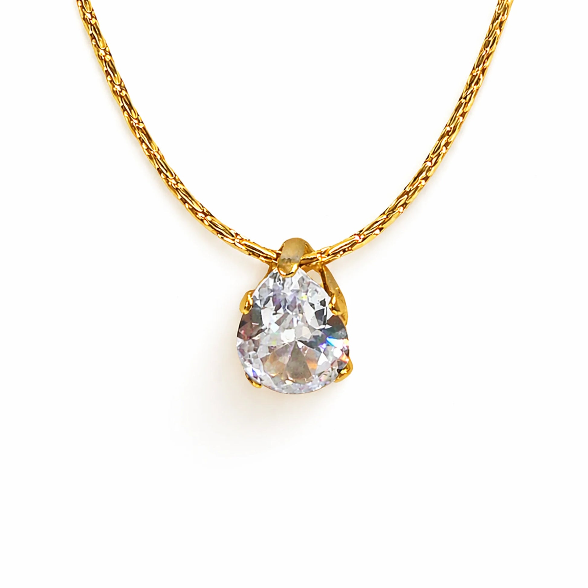 Gold necklace with a teardrop-shaped diamond pendant on a white background
