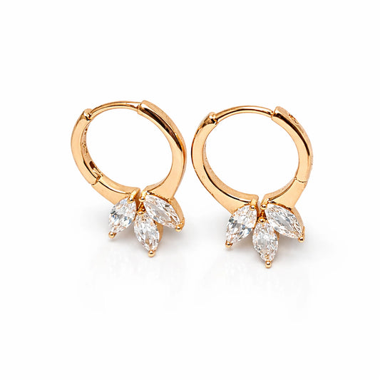 Gold hoop earrings with marquise-shaped gemstones on a white background