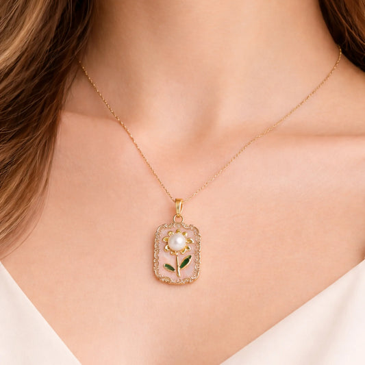 Model wearing anti-tarnish gold polish floral pendant necklace with pearl detail, showcasing everyday elegant styling