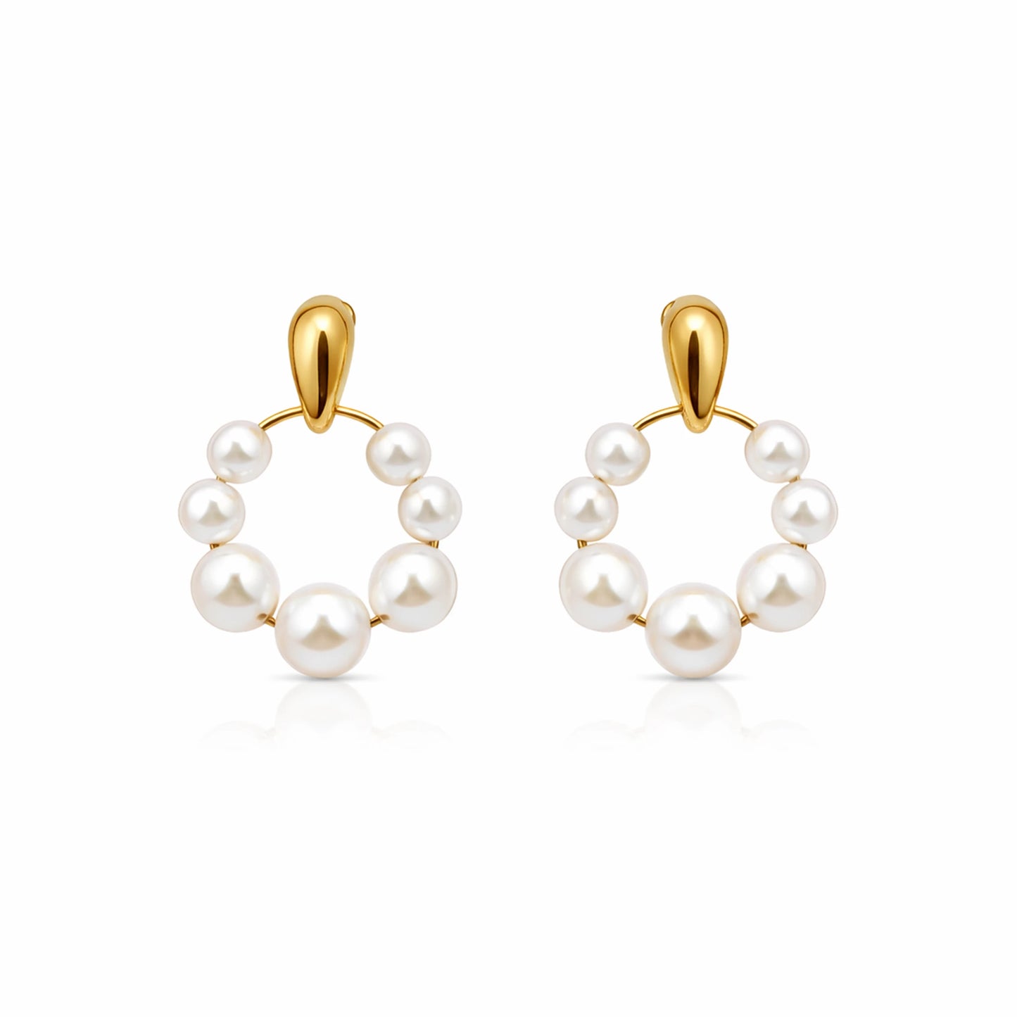 Pair of pearl hoop earrings with gold hooks on a white background