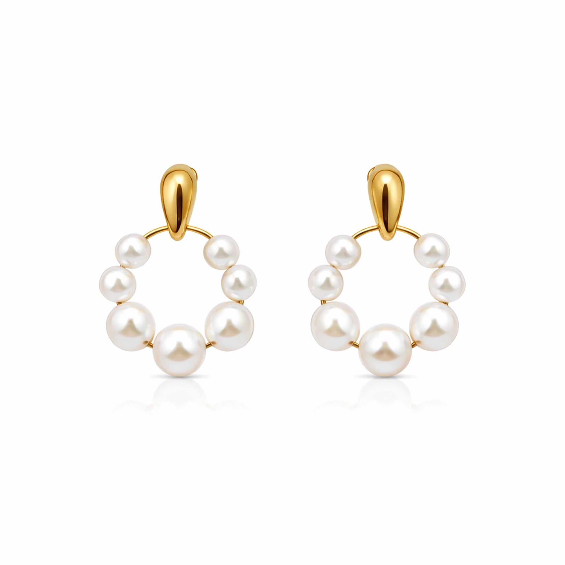 Pair of pearl hoop earrings with gold hooks on a white background