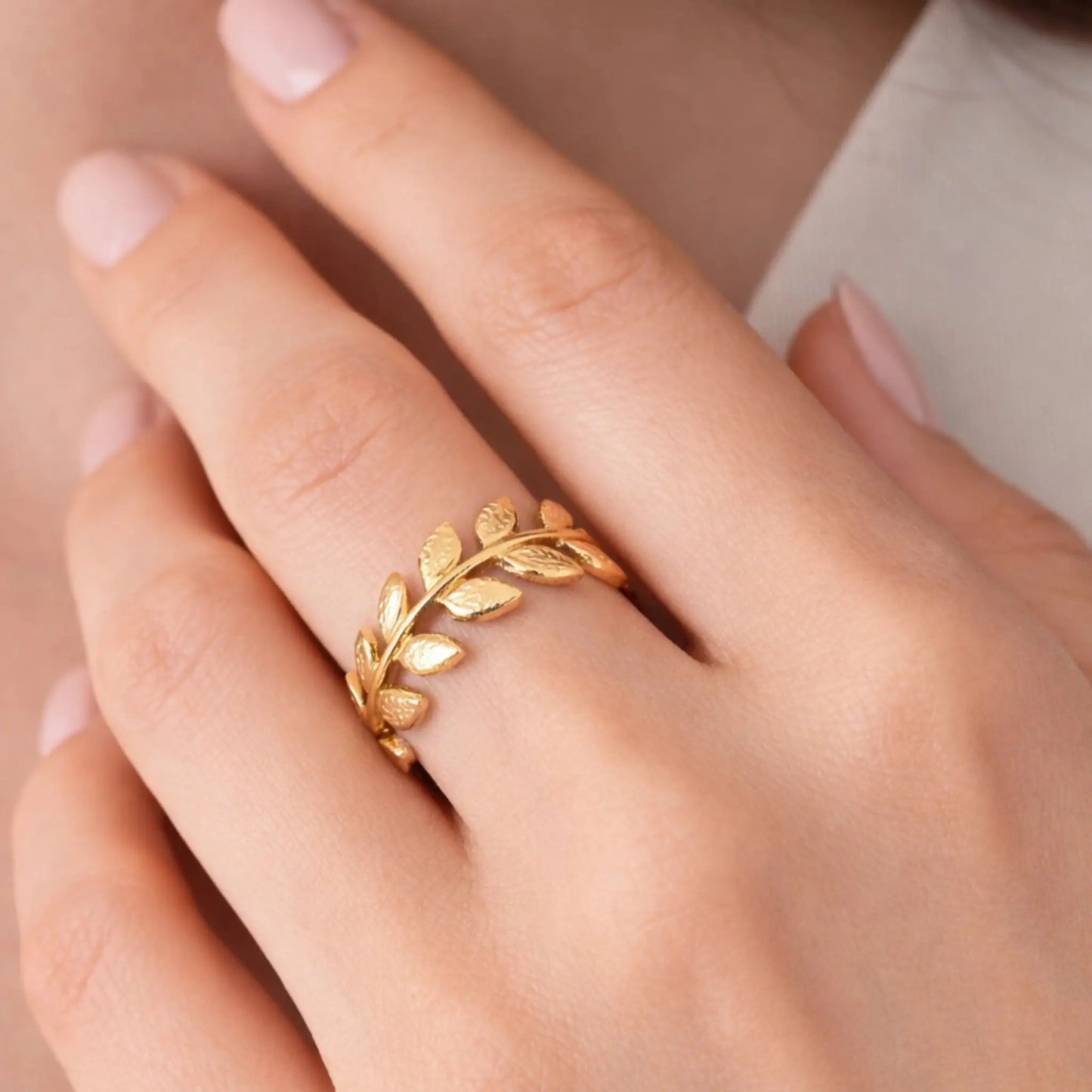 Model wearing gold leaf curve ring with elegant petal design and minimal aesthetic – yubiraa