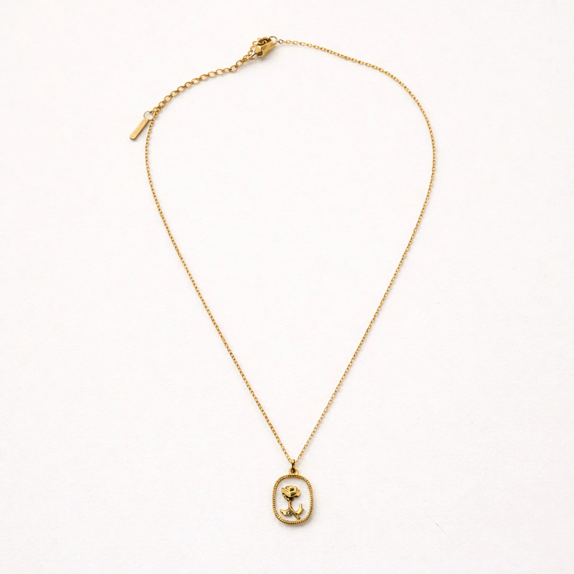 YUBIRAA rose pendant necklace flatlay on white background, minimal anti tarnish gold jewellery