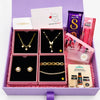 Gift set with jewelry, chocolate, and other items in a purple box