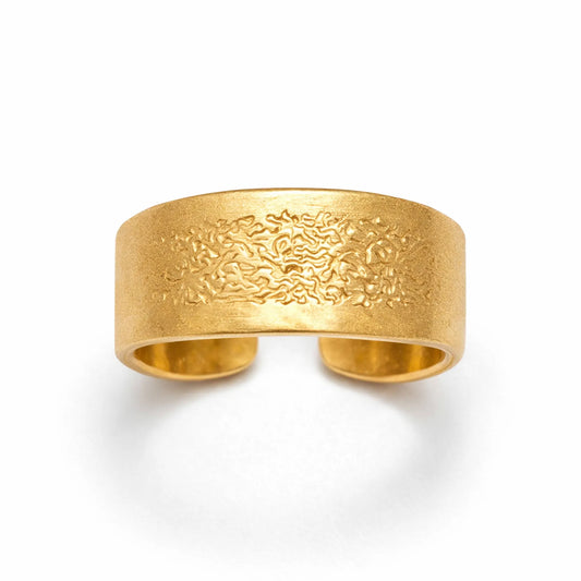 Gold textured adjustable band ring with wide hammered finish on white background
