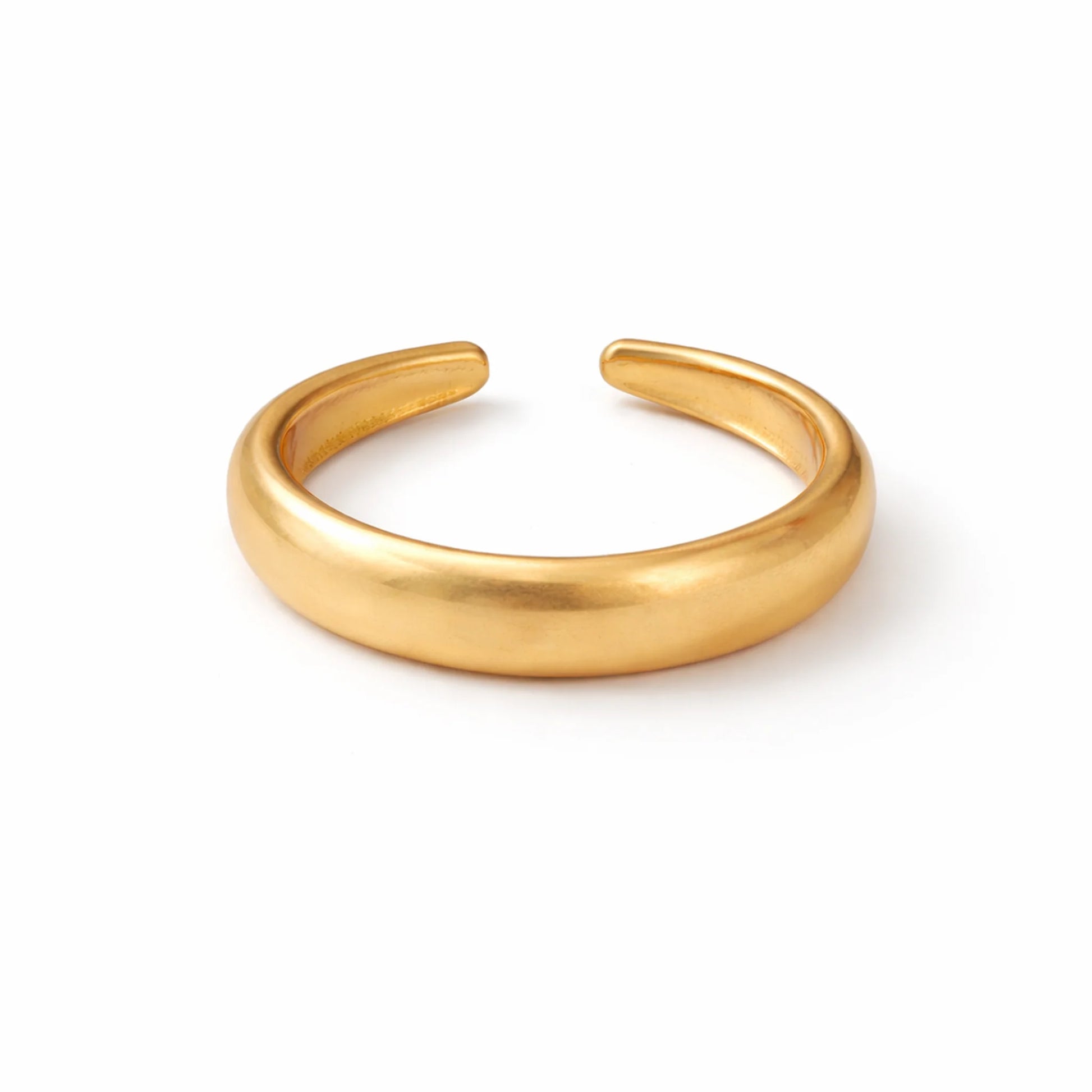 Gold bangle on a white background
