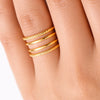 YUBIRAA adjustable gold stack ring worn on finger, showcasing modern layered statement design