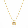 Gold necklace with a square pendant on a white background
