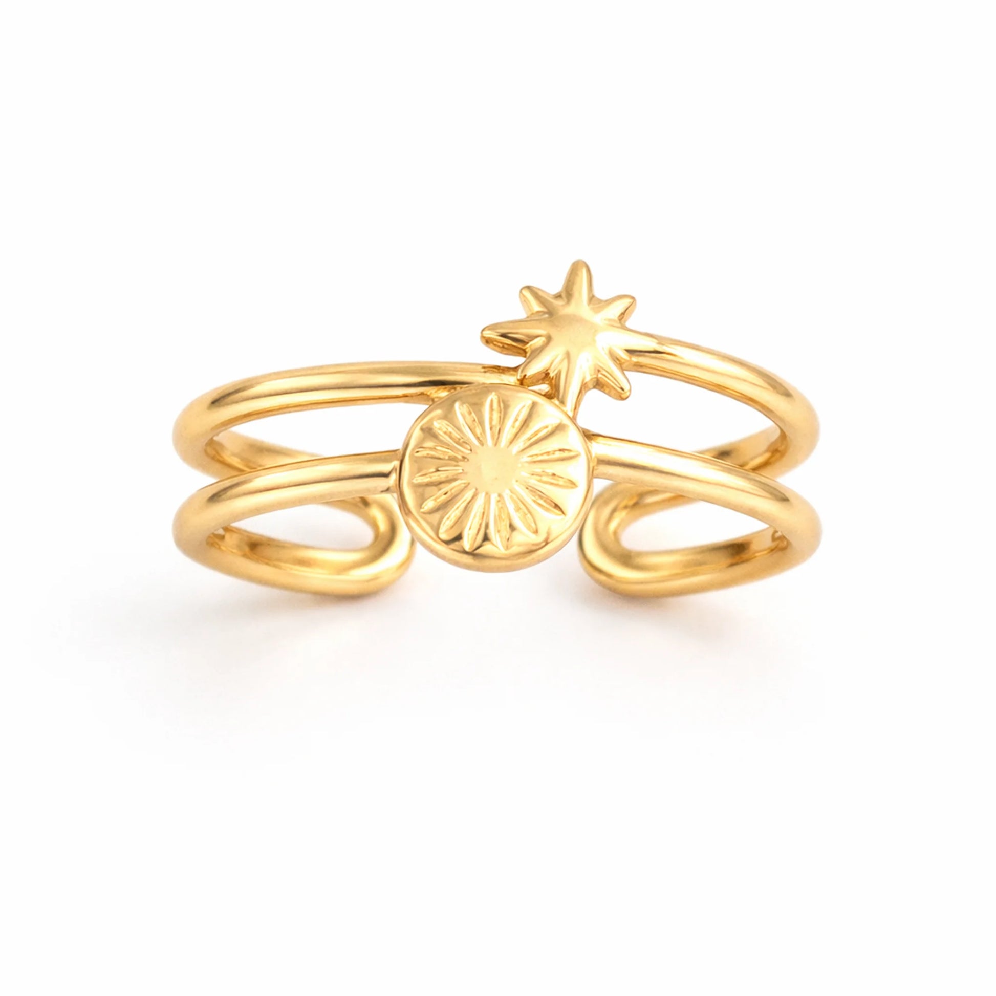 Gold ring with star and circle design on a white background