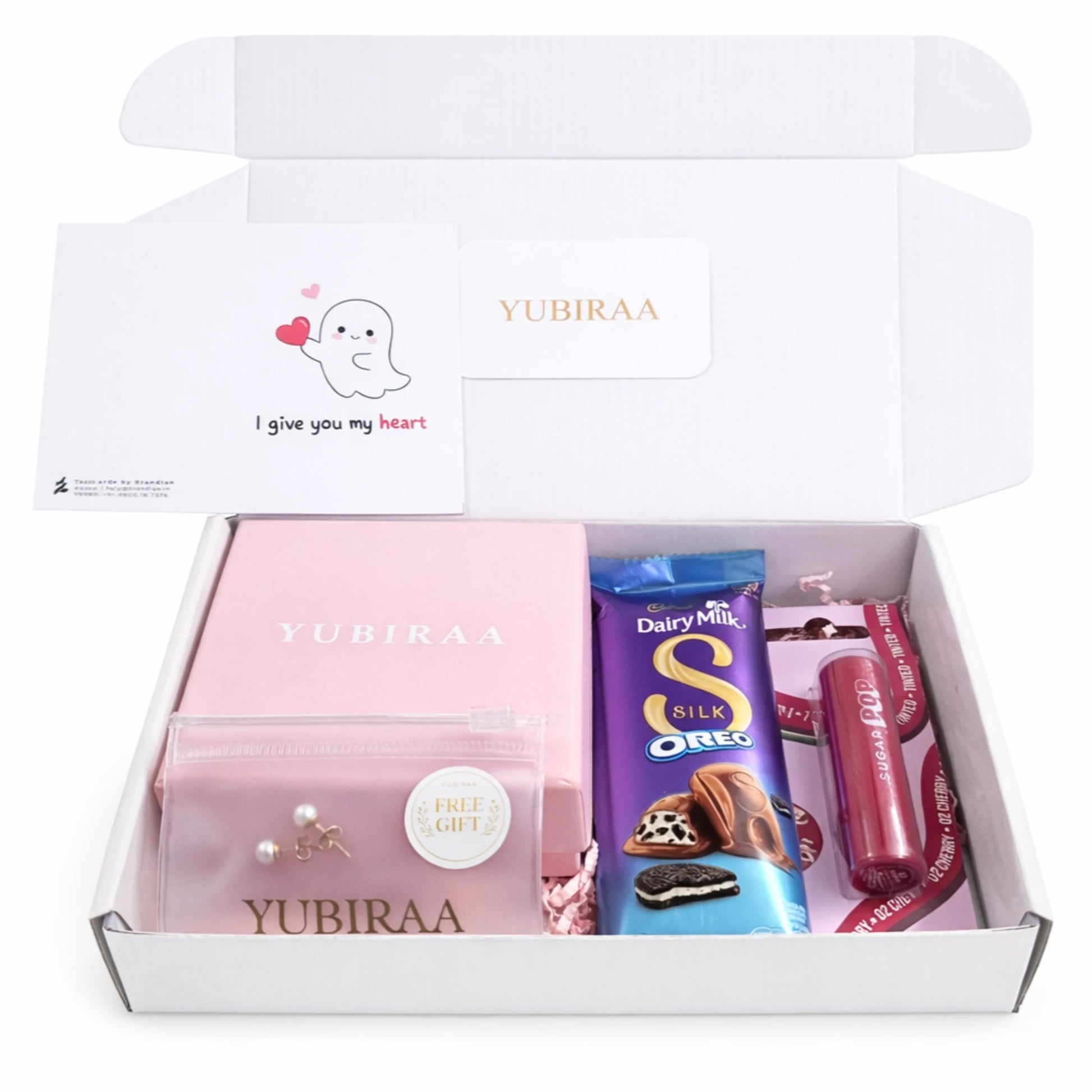 Gift box with Yubiraa products including a pink box, Choclates, and a lipbalm
