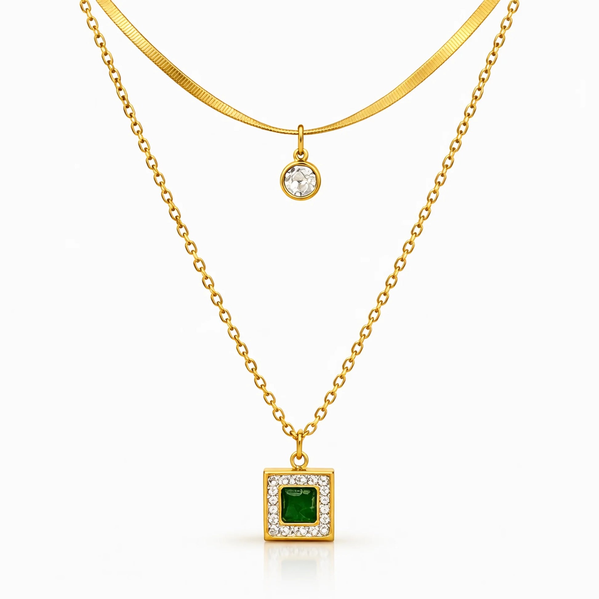 Layered gold tone necklace with emerald green square pendant and minimal round charm on upper chain