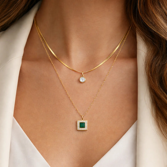 Double layer gold plated necklace with green square pendant worn by model for everyday luxury styling