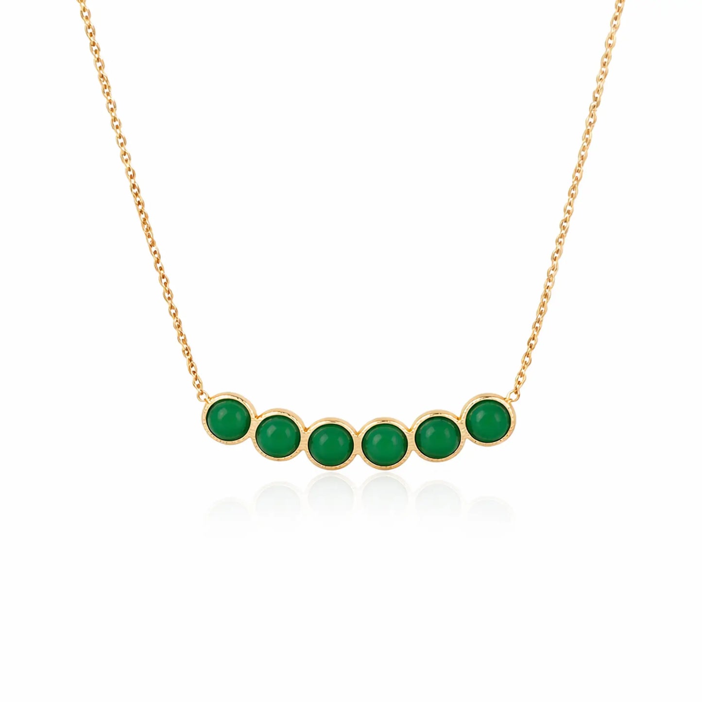 Gold necklace with green gemstones on a white background