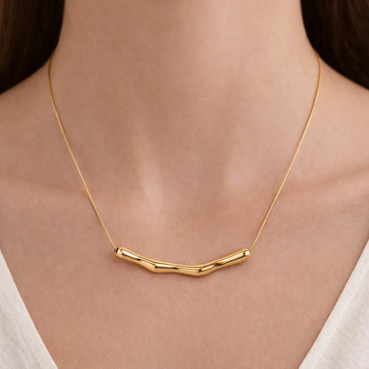 Model wearing Yubiraa Wave Bar Necklace with minimal anti tarnish gold plated finish
