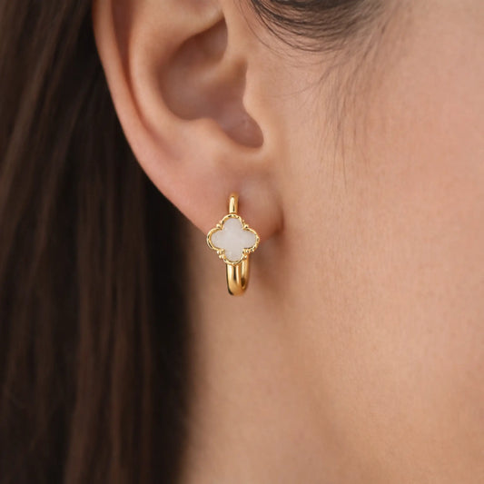 Model wearing YUBIRAA Eterna Bloom hoop earrings with white clover design and anti tarnish gold polish