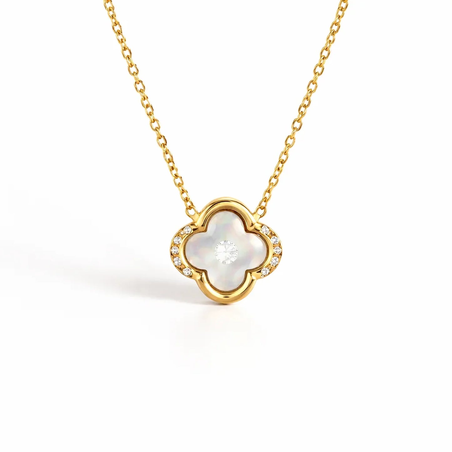 Close up of Ivory Glow Clover Necklace showing clover pendant with crystal accents in anti tarnish gold plated stainless steel