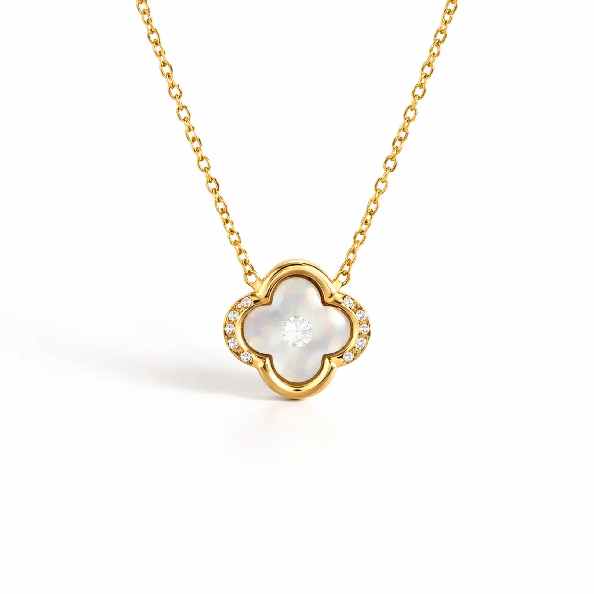 Close up of Ivory Glow Clover Necklace showing clover pendant with crystal accents in anti tarnish gold plated stainless steel