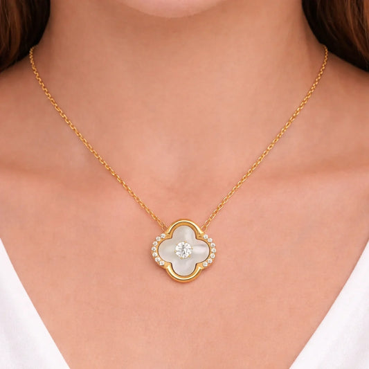 Model wearing Ivory Glow Clover Necklace in anti tarnish gold plated stainless steel with clover pendant