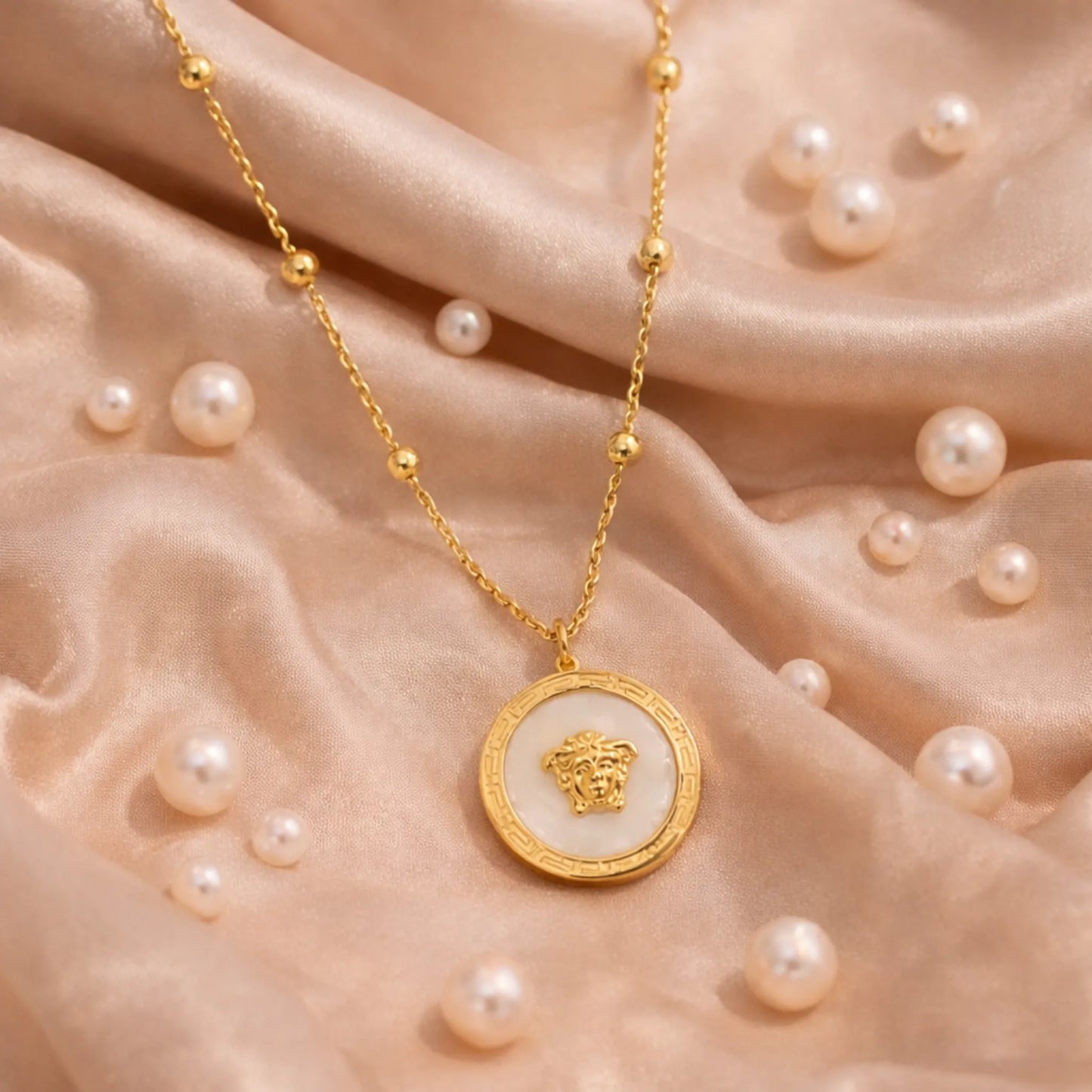 Flat lay of Yubiraa Final Ivory Glow Clover Necklace in anti tarnish gold plated stainless steel showing full chain length”