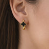 Model wearing YUBIRAA Midnight Bloom hoop earrings with black clover design and anti tarnish gold polish