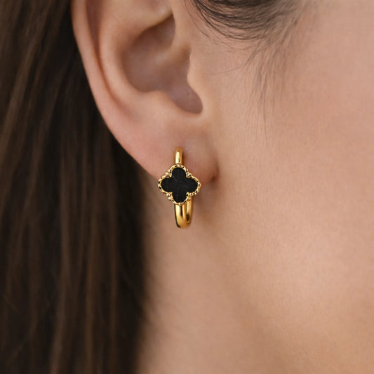 Model wearing YUBIRAA Midnight Bloom hoop earrings with black clover design and anti tarnish gold polish