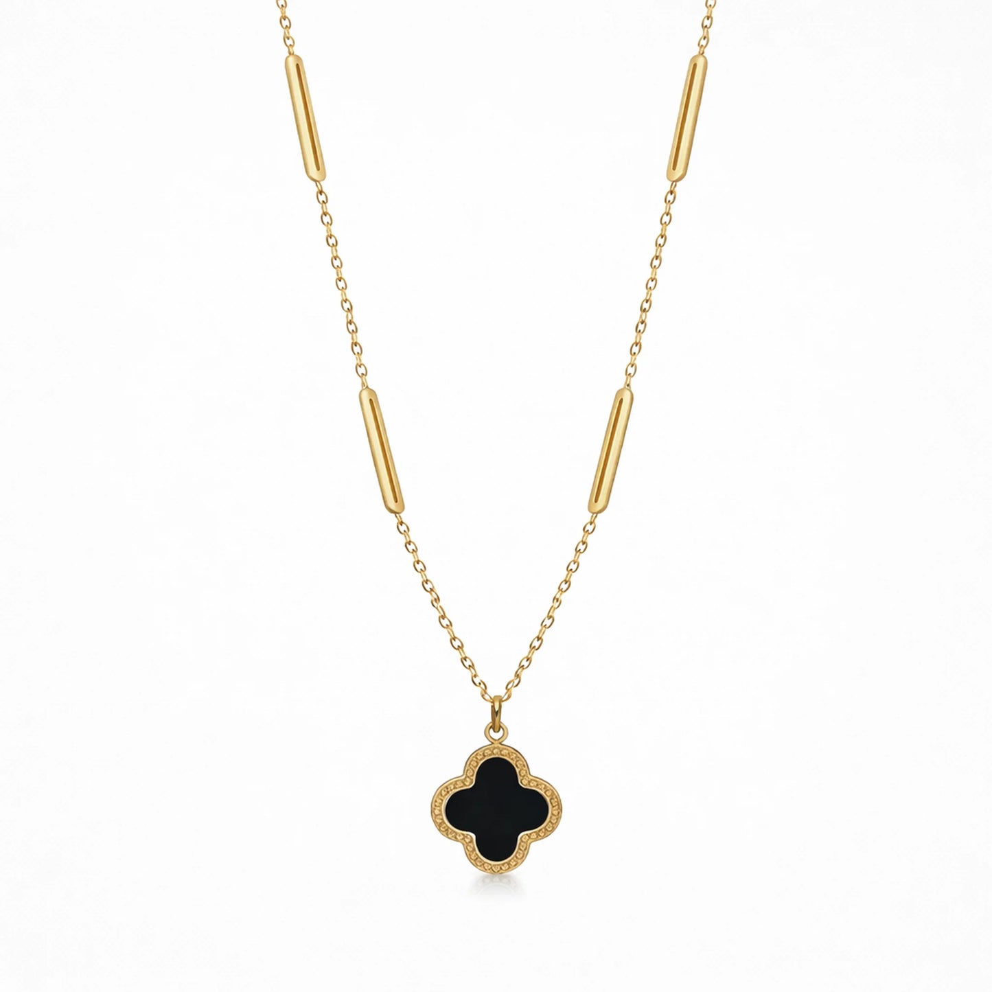 Full view of Yubiraa Final Ivory Glow Clover Necklace featuring black clover pendant and gold plated chain