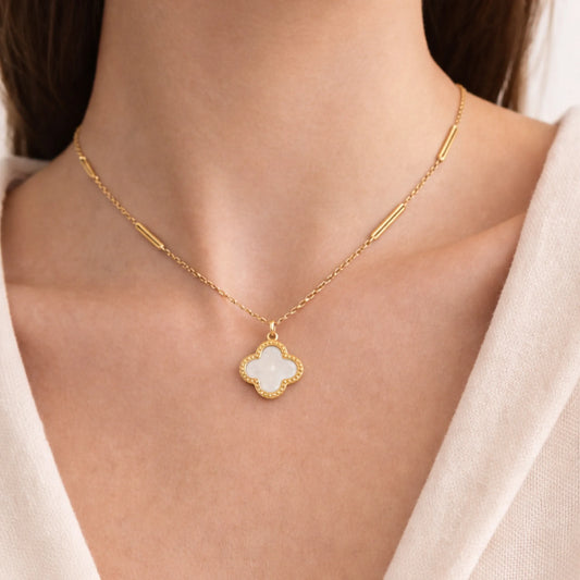 Model wearing Yubiraa Final Ivory Glow Clover Necklace with ivory clover pendant in gold plated stainless steel, neck only view